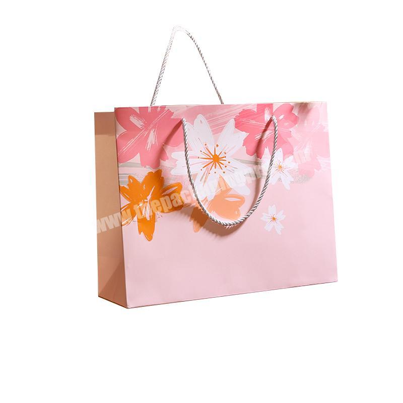 Free design paper bags custom logo wholesale gift paper bags with handle