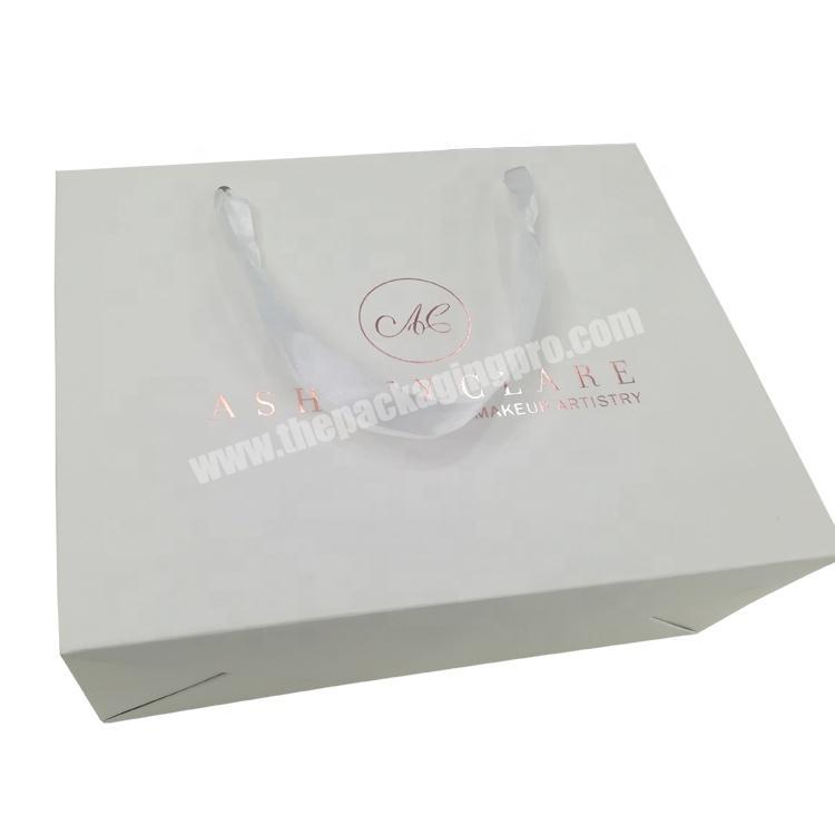 Embossing custom rose gold foil logo printed paper makeup gift bag