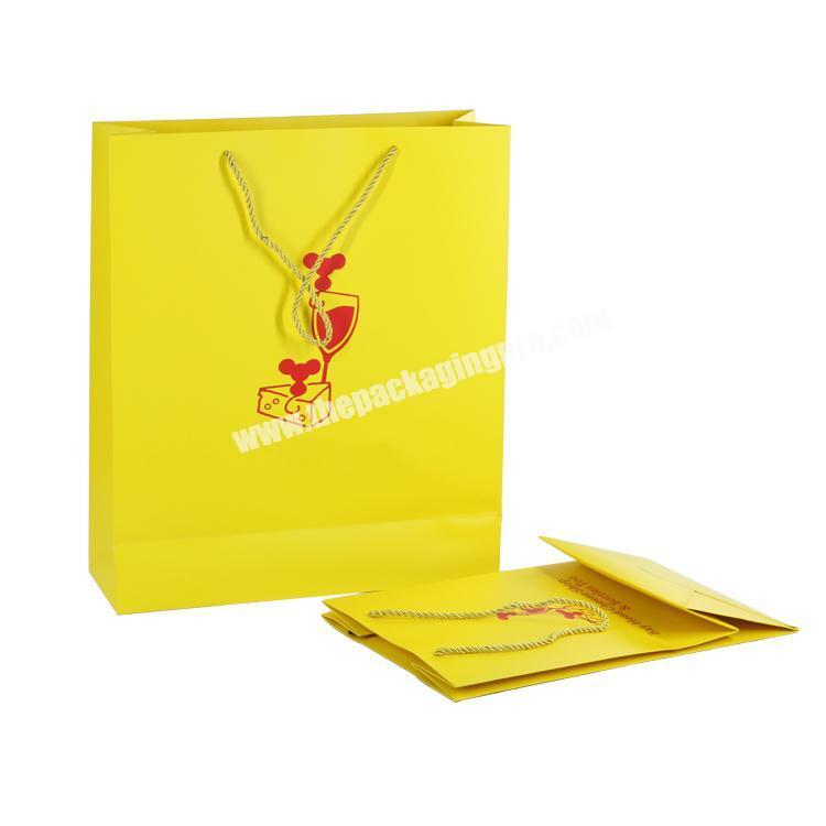 2019 New coated paper packaging , yellow custom size paper bags for shopping store
