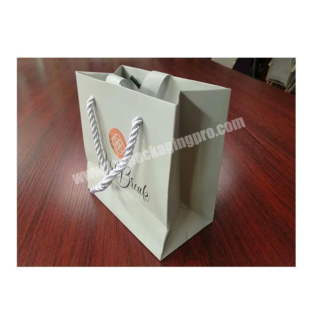 Printed Luxury white cards Clothing cosmetics Packaging Shopping Paper Bags ribbon handle with bowknot