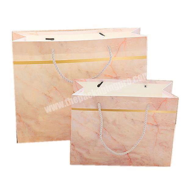 Beautiful marble pink glossy paper gift  bag High-end customized gold foil logo paper bags