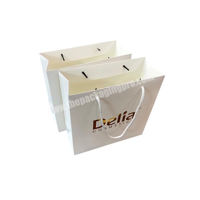 Professional custom white cosmetic paper bag with gold foil brand name logo