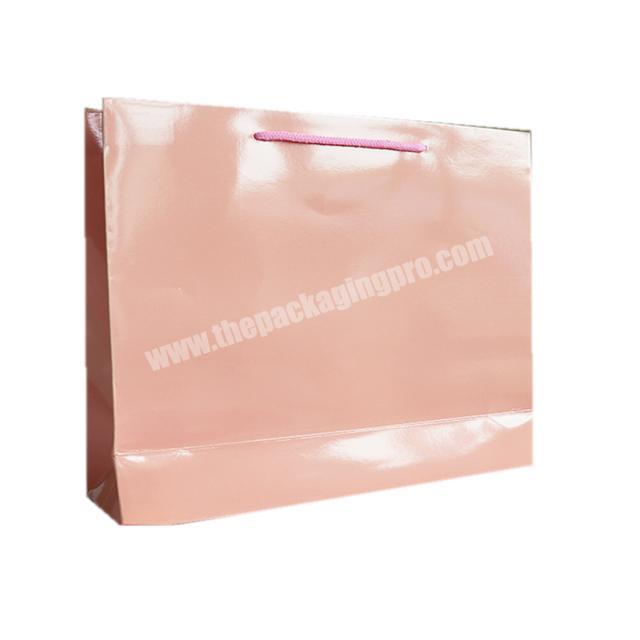 Factory price wholesale pink glossy paper shopping bag logo printing Customized size