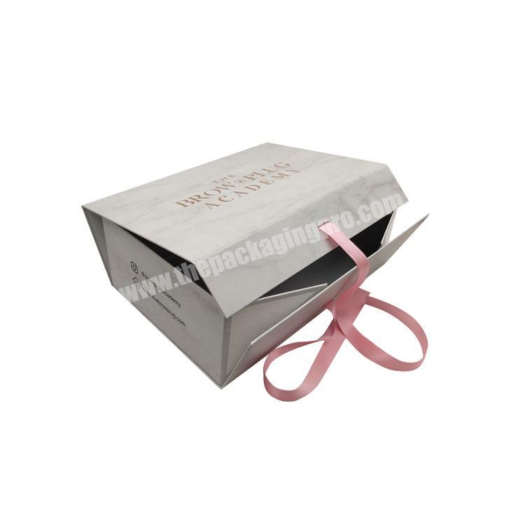 Luxury megnetic rigid folding cosmetic box gift boxes with ribbon closure for makeup