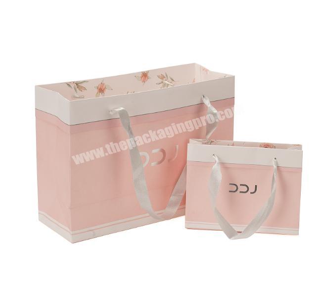 Wholesale pink overnight paper bag with ribbon handles