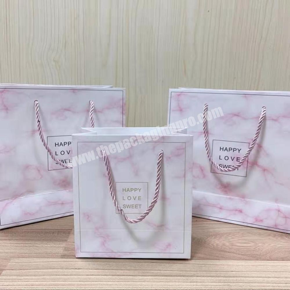 Wholesale custom pink marble bag packaging shopping paper bag with handles
