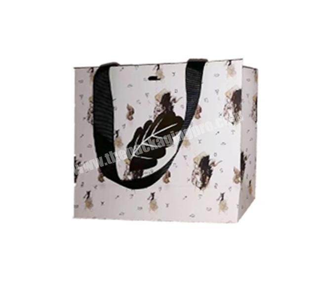 Hot sale luxury gold foil logo printing shopping paper bag with black screw ribbon