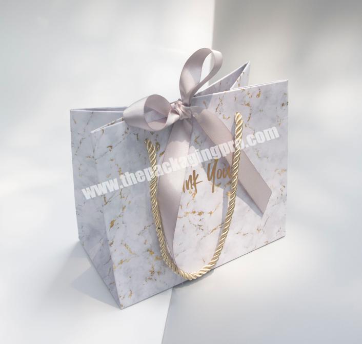 Guangzhou high quality custom elegant marble gift paper bag cosmetic bag with handle