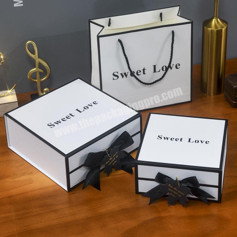Premium Rigid Cardboard Lipsticks Perfume Packaging Cosmetics Packaging White Magnetic Gift Box with Black Ribbon