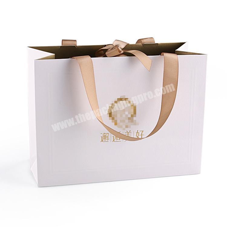 Wholesale 2020 Cosmetic Shopping White Kraft Merchandise Custom Ribbon Paper Bag