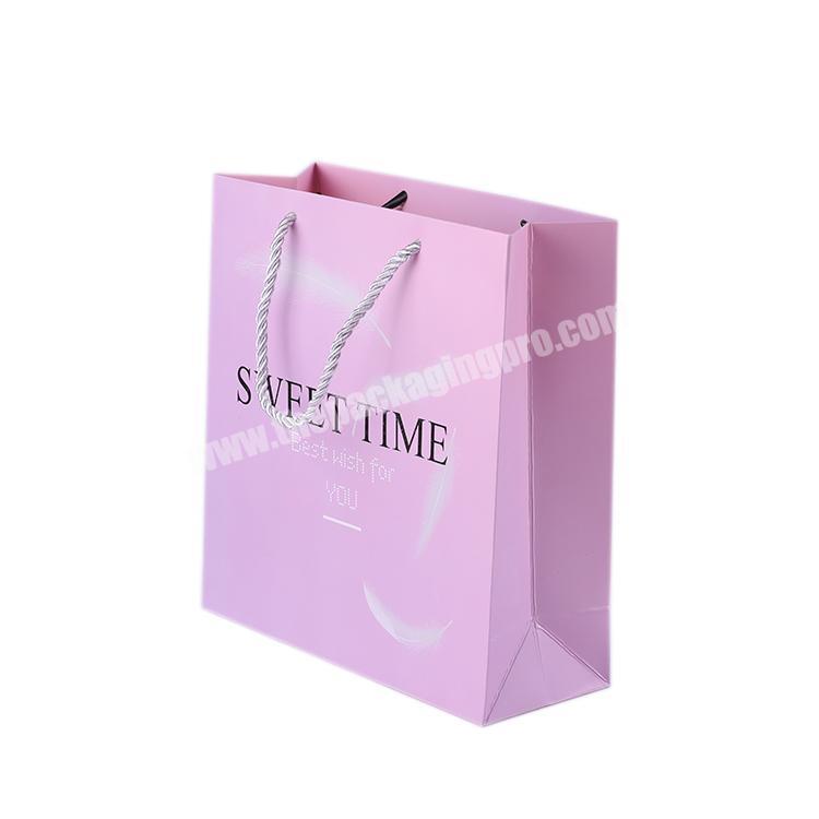 Custom Logo Printed lamination Finish Pink Paper Shopping Bag With Grosgrain Ribbon Handle For Exhibition