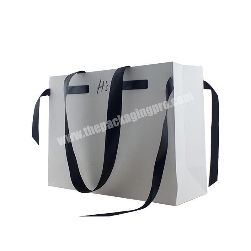Hot factory wholesale packing paper shopping bags wholesale paper bags with your own logo
