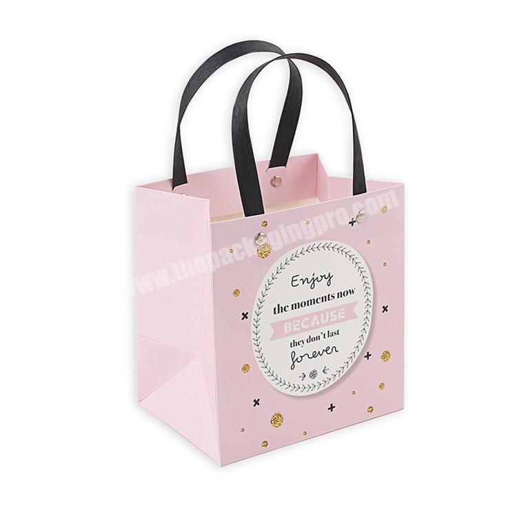 China production bag paper wholesale fascinated gift paper bag reinforced paper bag with handle
