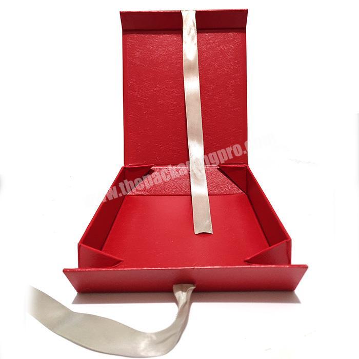 Cosmetic rigid folding cardboard magnetic foldable gift paper packaging box with ribbon closure manufacture