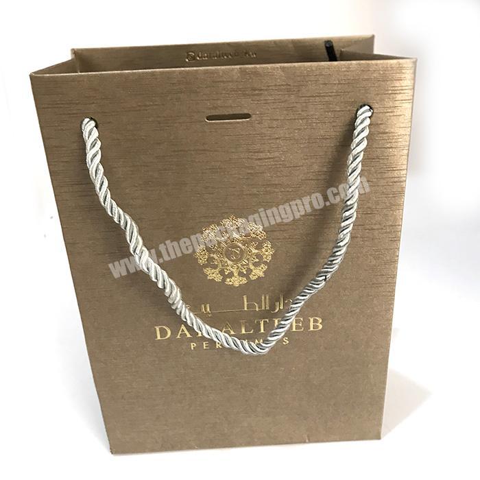 Custom logo printed cheap christmas fancy cosmetic paper shopping jewelry packaging gift bag with rope Twisted handle wholesale