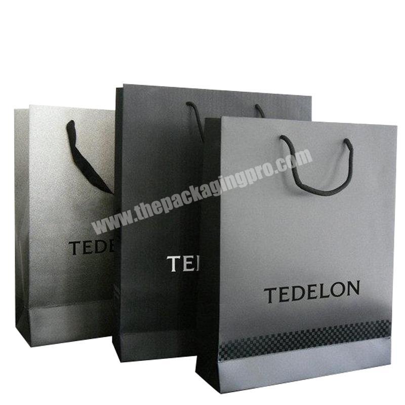 Customized black high quality shopping paper bags for clothing and pants