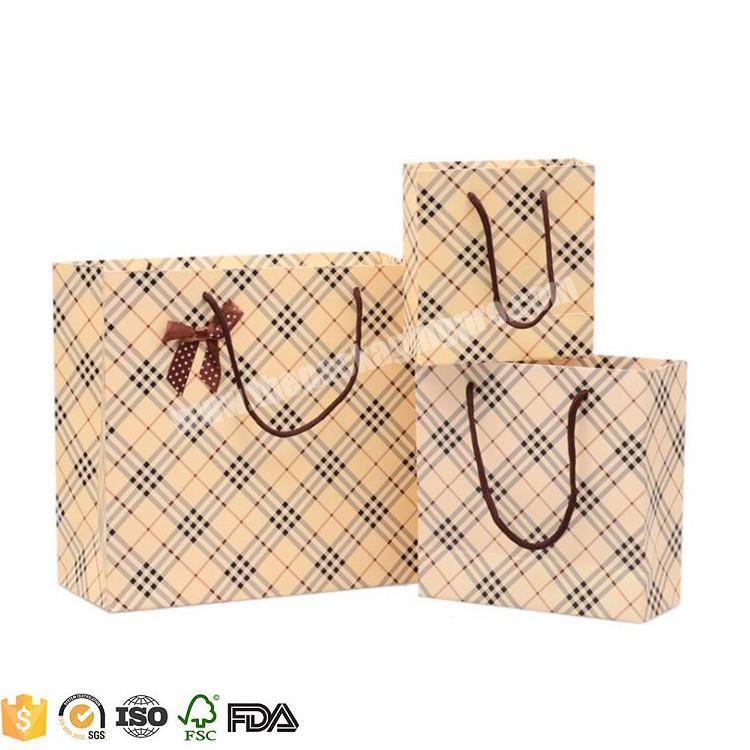 Low cost yiwu factory shopping bag paper high quality wholesale custom print paper packaging bag