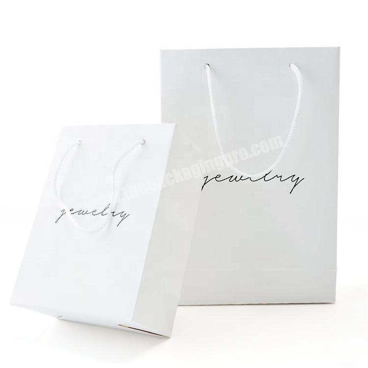 Small white cardboard paper gift bag for jewelry