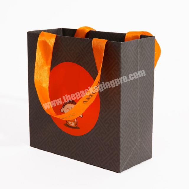 Wholesale custom printed luxury free simple design paper bag with handle