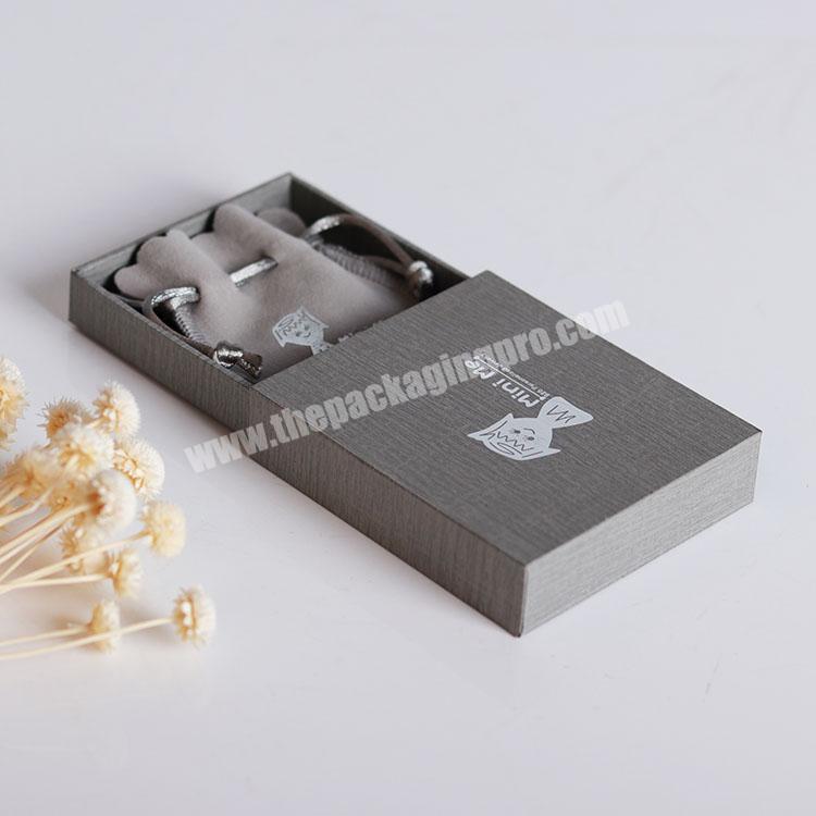 Wholesale customized luxury solid paper jewelry packaging box with custom velvet pouch