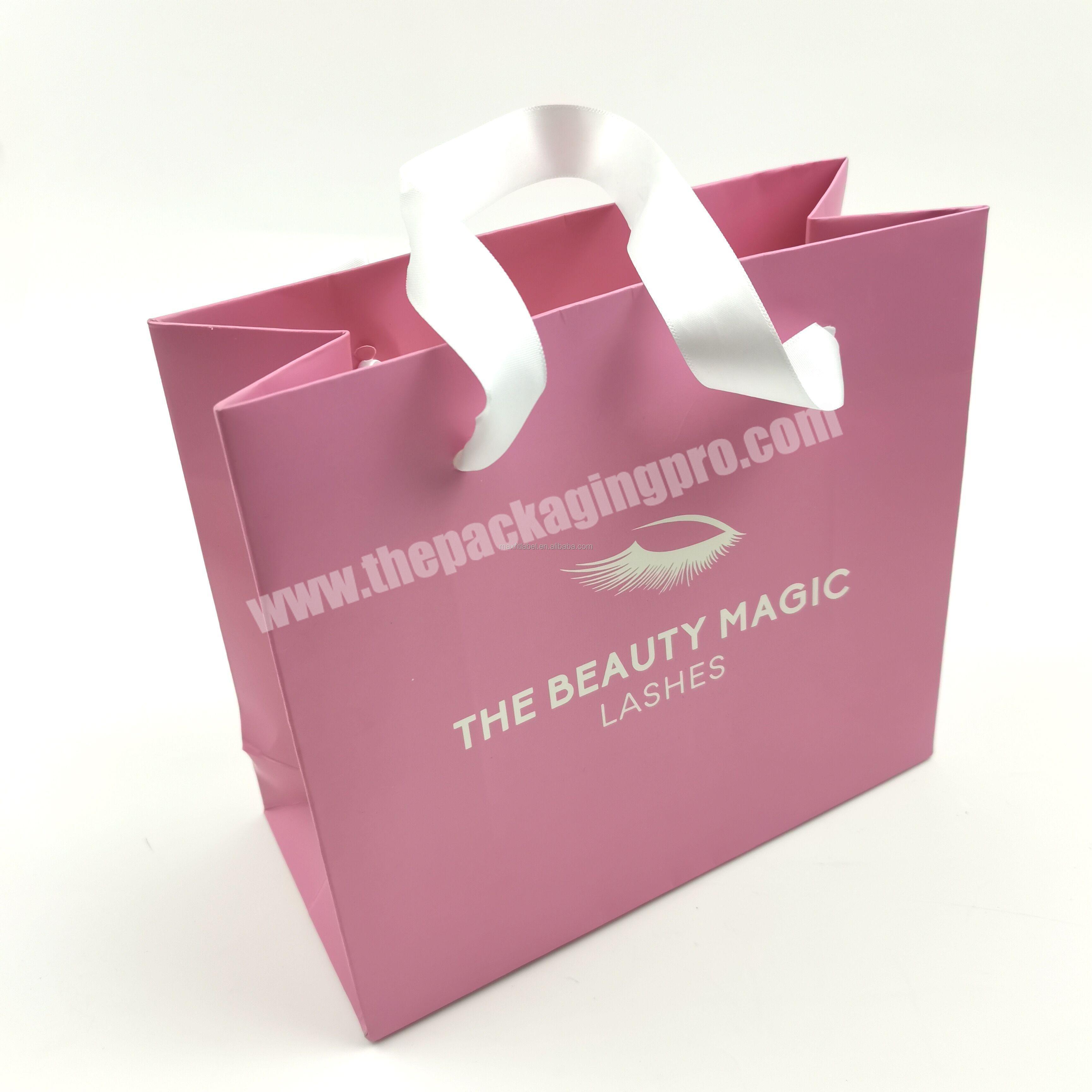 Wholesales custom logo glossy laminated pink shopping paper bags cosmetic products carry bags for clothing and shoes packaging