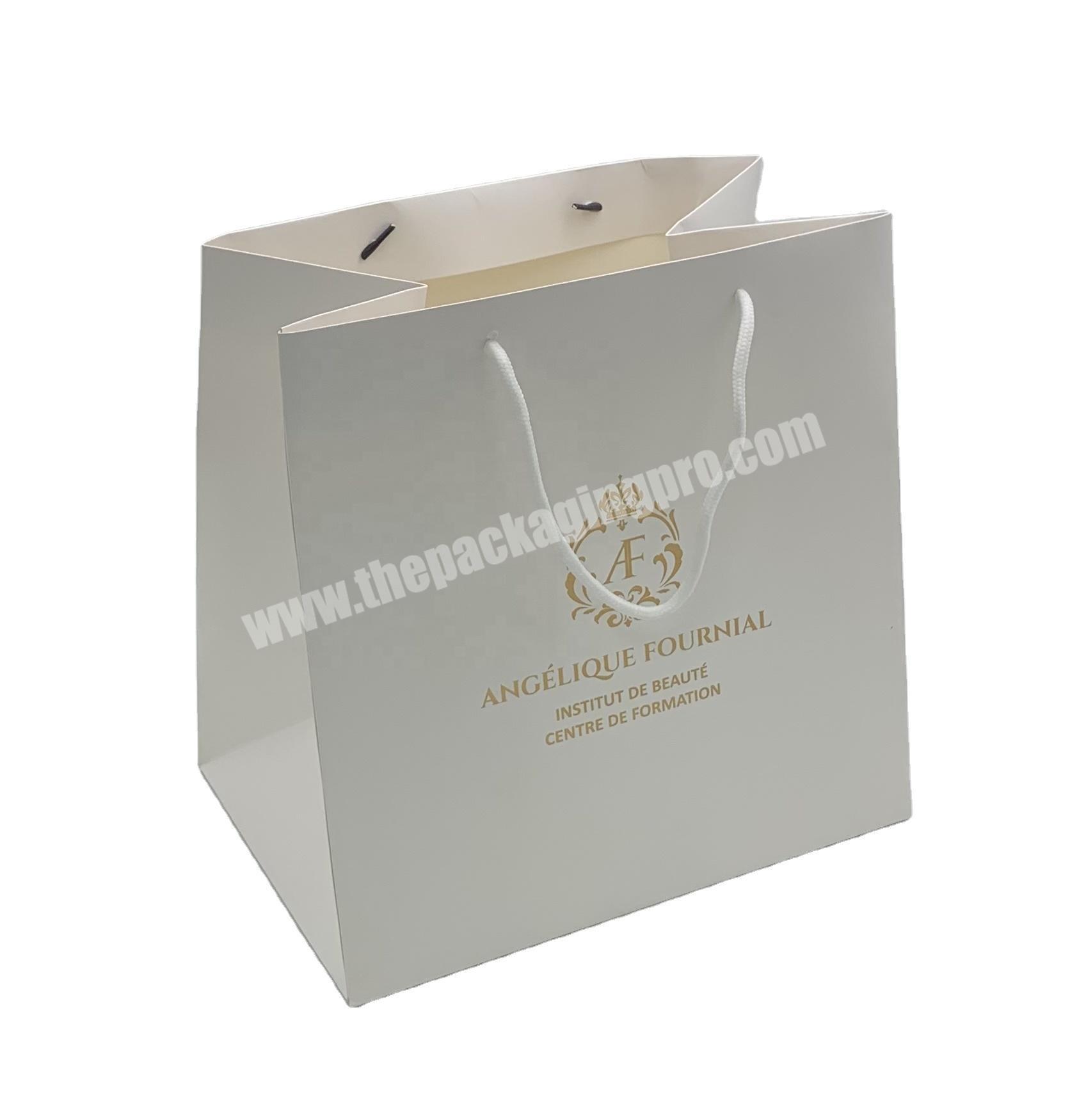 hot sales white cardboard clothing and dress packing fancy gift bags custom shopping paper bags