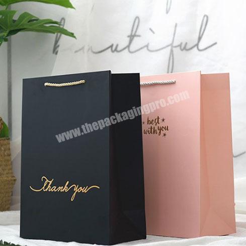 Luxury Garment Kraft Paper bag with customized logo black shopping bags on sale