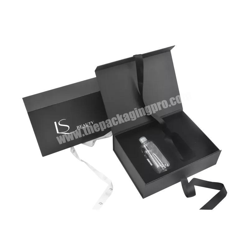Custom Luxury Black Book Shaped Magnetic cosmetic Box with Ribbon Cardboard Skin Care Bottle Packaging