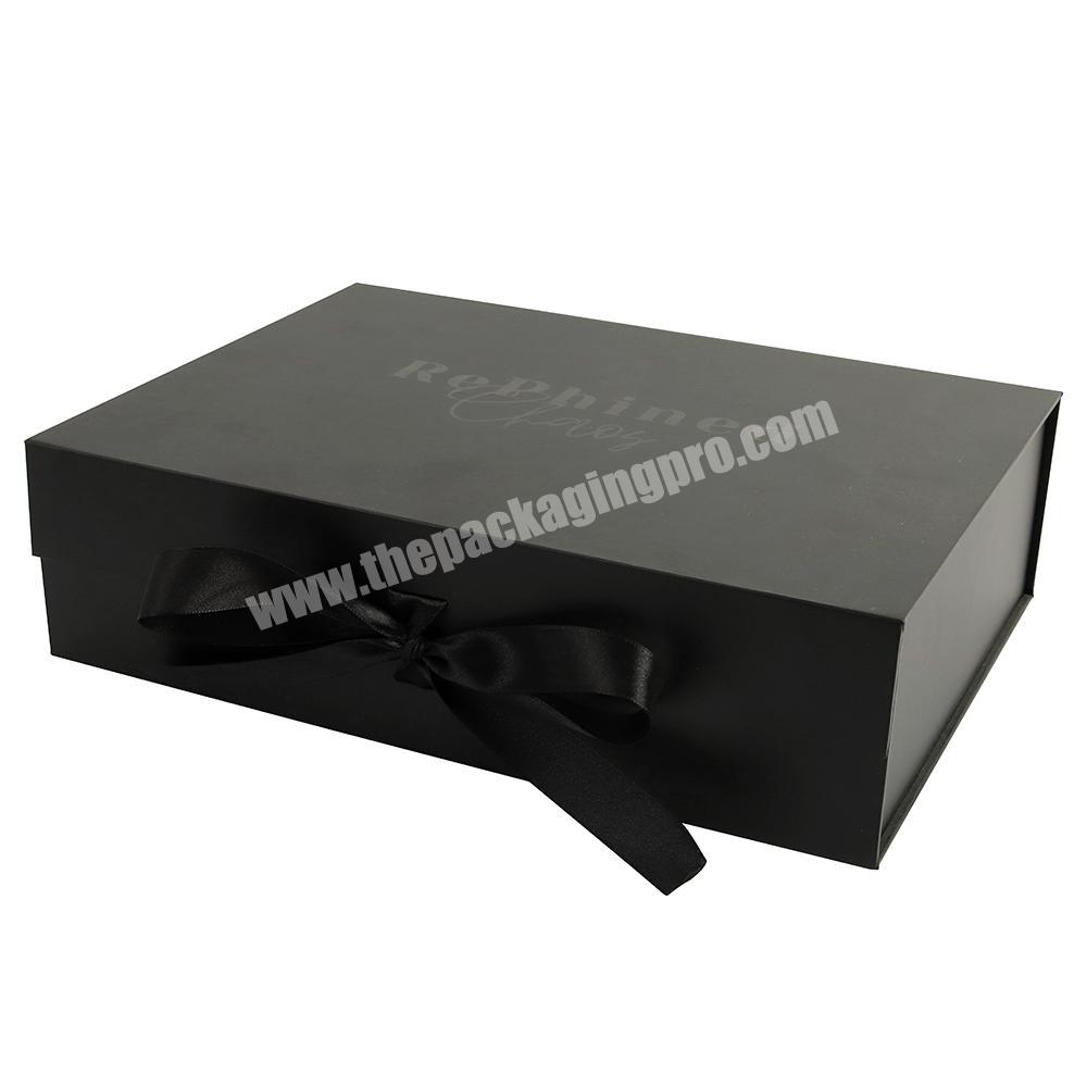 Fully customized solid black paper box package with folding magnetic closing flap lid