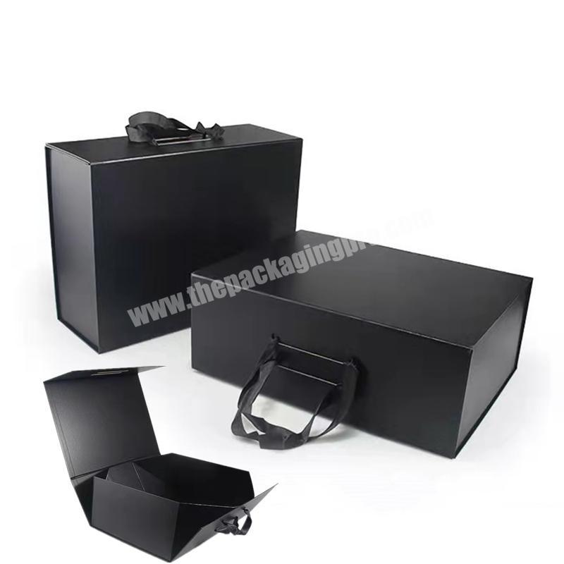 Luxury black folding rigid cardboard paper box packaging customized magnetic flip gift box with ribbon handle