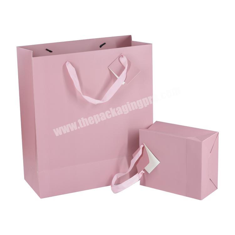 Luxury custom logo recyclable clothes packaging pink paper gift shopping bags eco friendly with handle