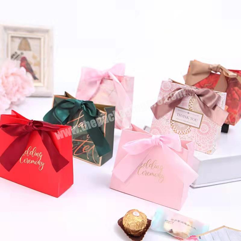 Wholesale eco-friendly paper material boutique packaging bag custom printing elegant paper gift bags with ribbon