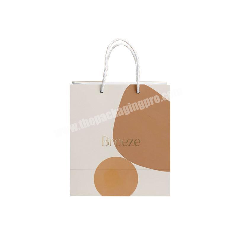 custom logo clothing shopping bag packaging gift white kraft paper bag with rope handle for cosmetics