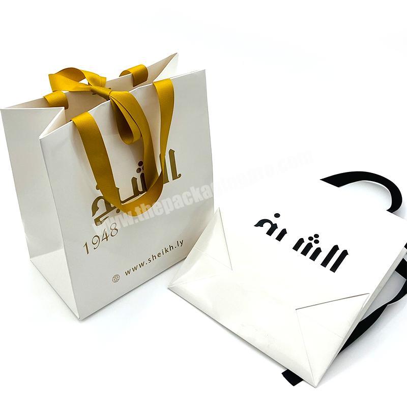 China cheap paper bags with your own logo custom paper bag shopping paper bags