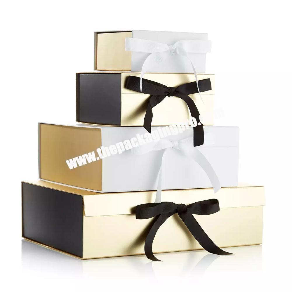 Custom Logo Exquisite Metallic Gold Packaging Magnetic Folding Rigid Paper Hamper Gift Boxes With Ribbon Closure