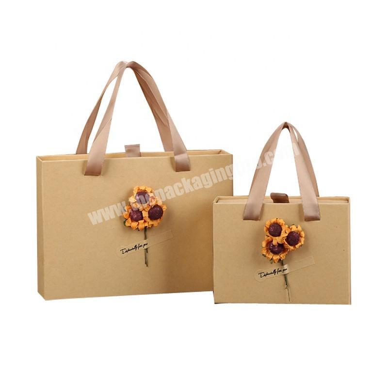 Environmentally friendly shopping bag unique design clothes packaging Thick and durable gift bag with flowers paper bag handbag
