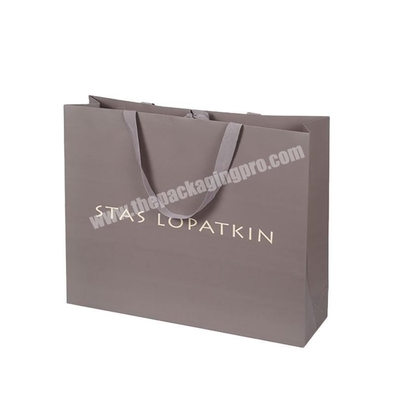 High-end white cardboard clothing store tote bag custom logo gift paper bag women's tote bags