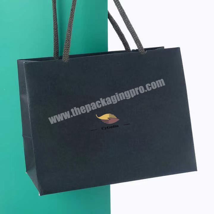 Factory free sample white color coated gift paper bag with black line