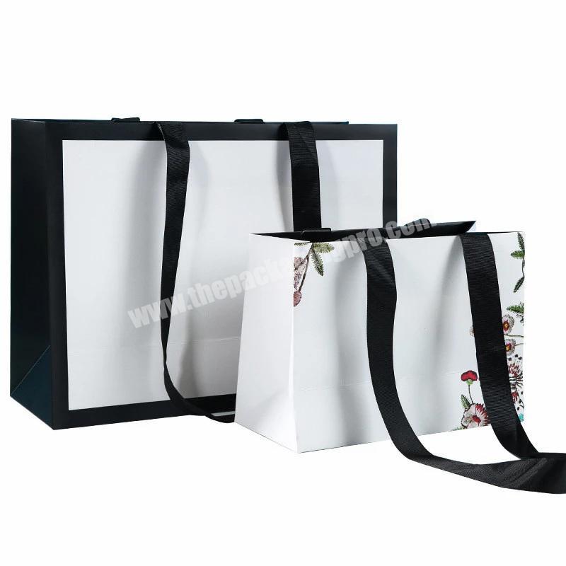 Wholesale Eco friendly bags paper wholesale custom logo paper bag ribbon handle paper shopping bag for clothes