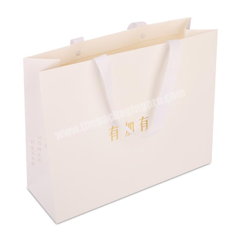 custom gold foil strip white paper gift packaging bag with fabric handles