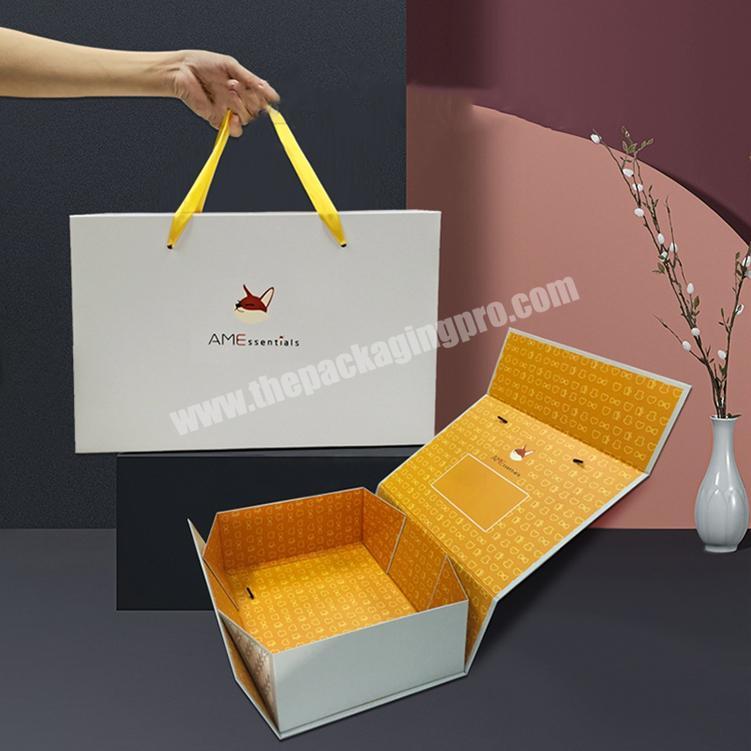 luxury custom logo printing textured glossy magnetic garment paper packaging with handle gift boxes for clothes