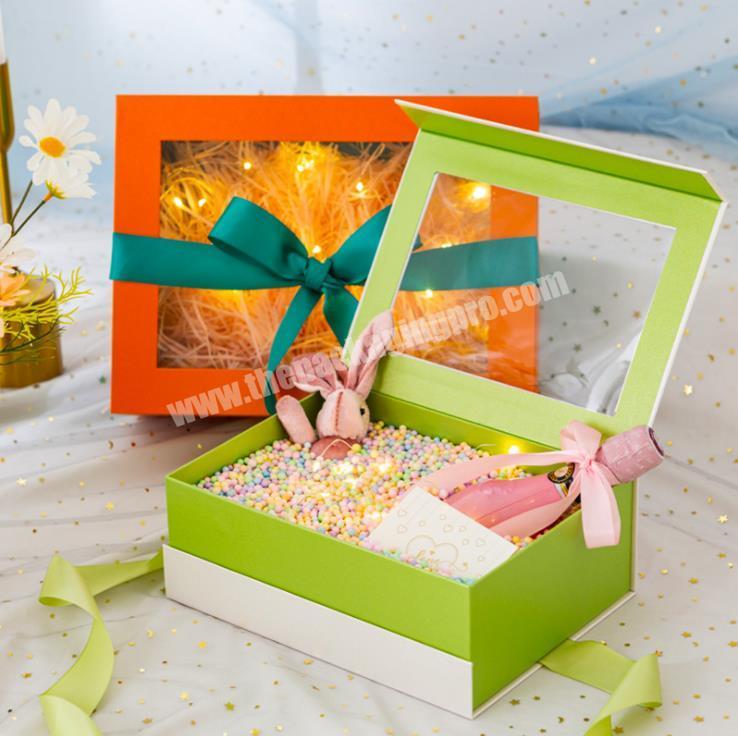 Gift box with transparent window and ribbon