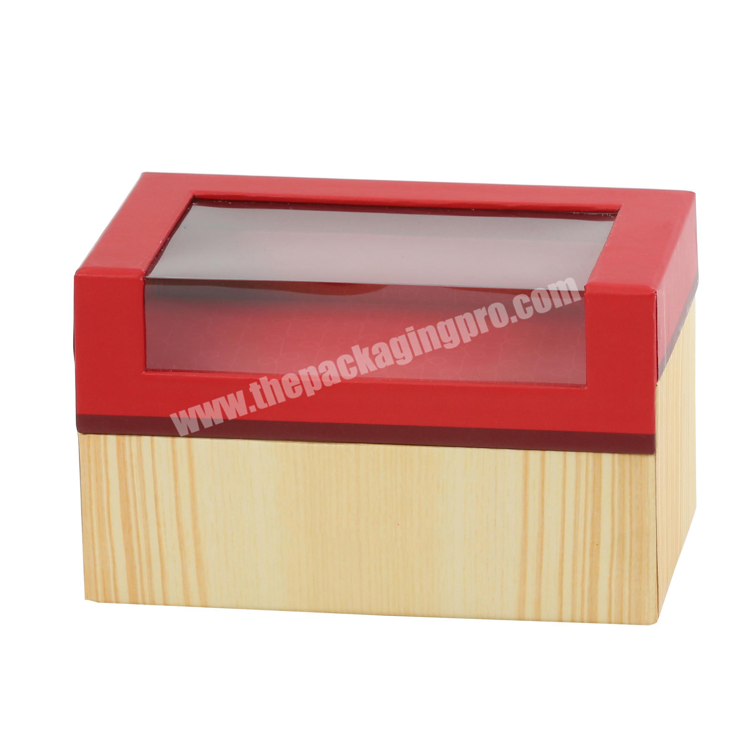 Hinged gift box in embossed texture paper with PVC window made by China packaging factory