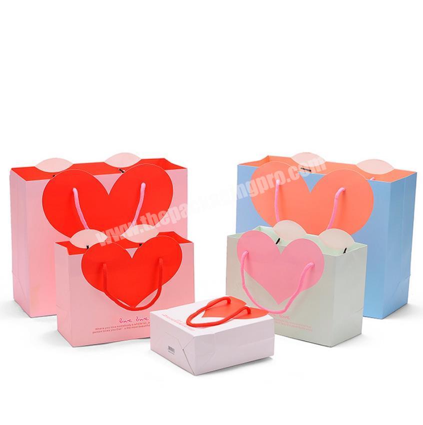 Wholesale luxury fancy cute plain paper bag with big heart shaped packaging