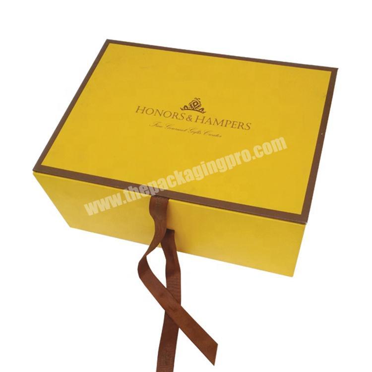 different sized cardboard hamper box with ribbon handle
