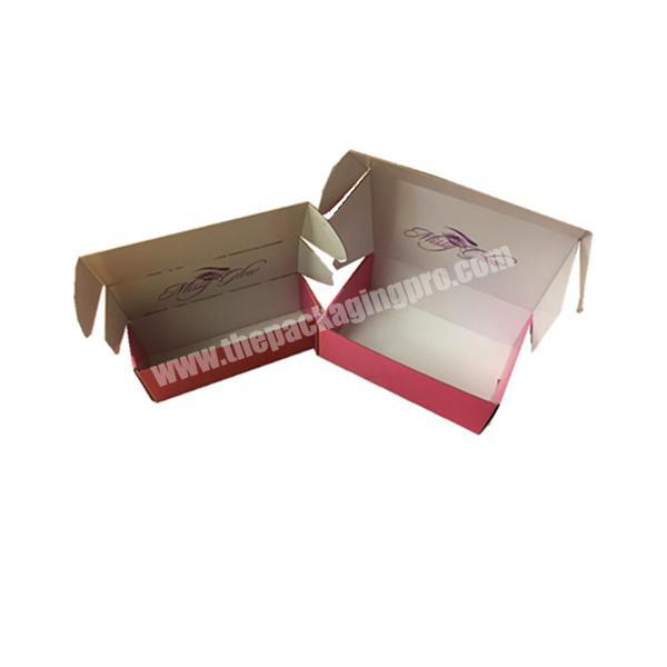 small pink mailer box