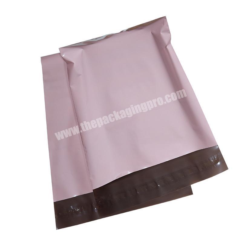 Self adhesive pink coloured biodegradable recyclable plastic mail bags