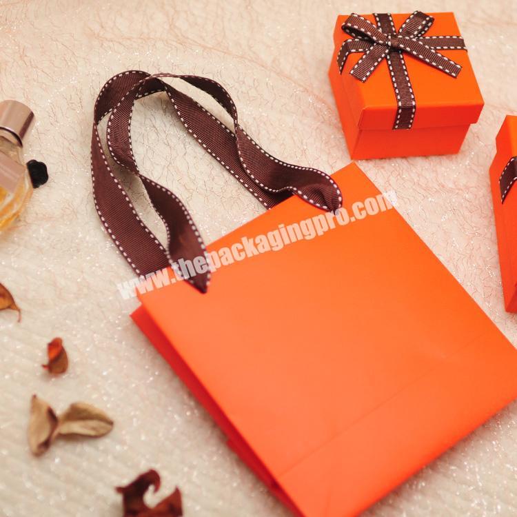 Instagram style orange high-end hand bag  birthday gift candy packaging custom logo