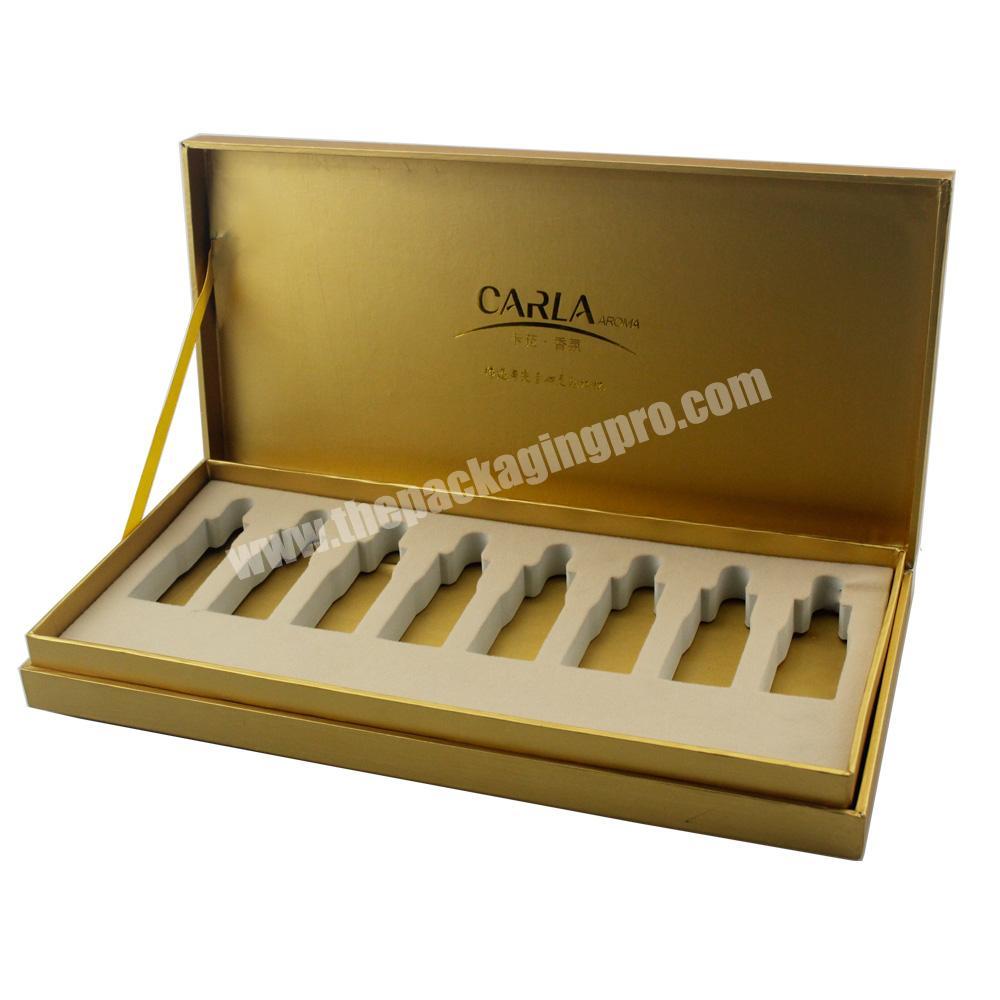 Alibaba luxury gold paper box with EVA slots for cosmetics packaging