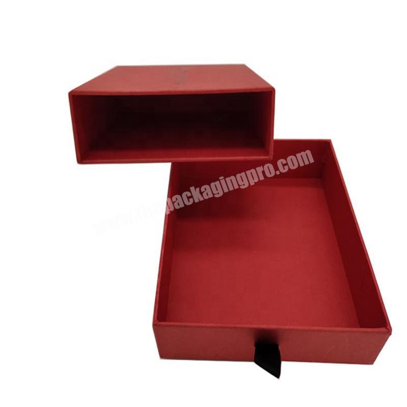 Beautiful red paper packaging gift box with ribbon handle